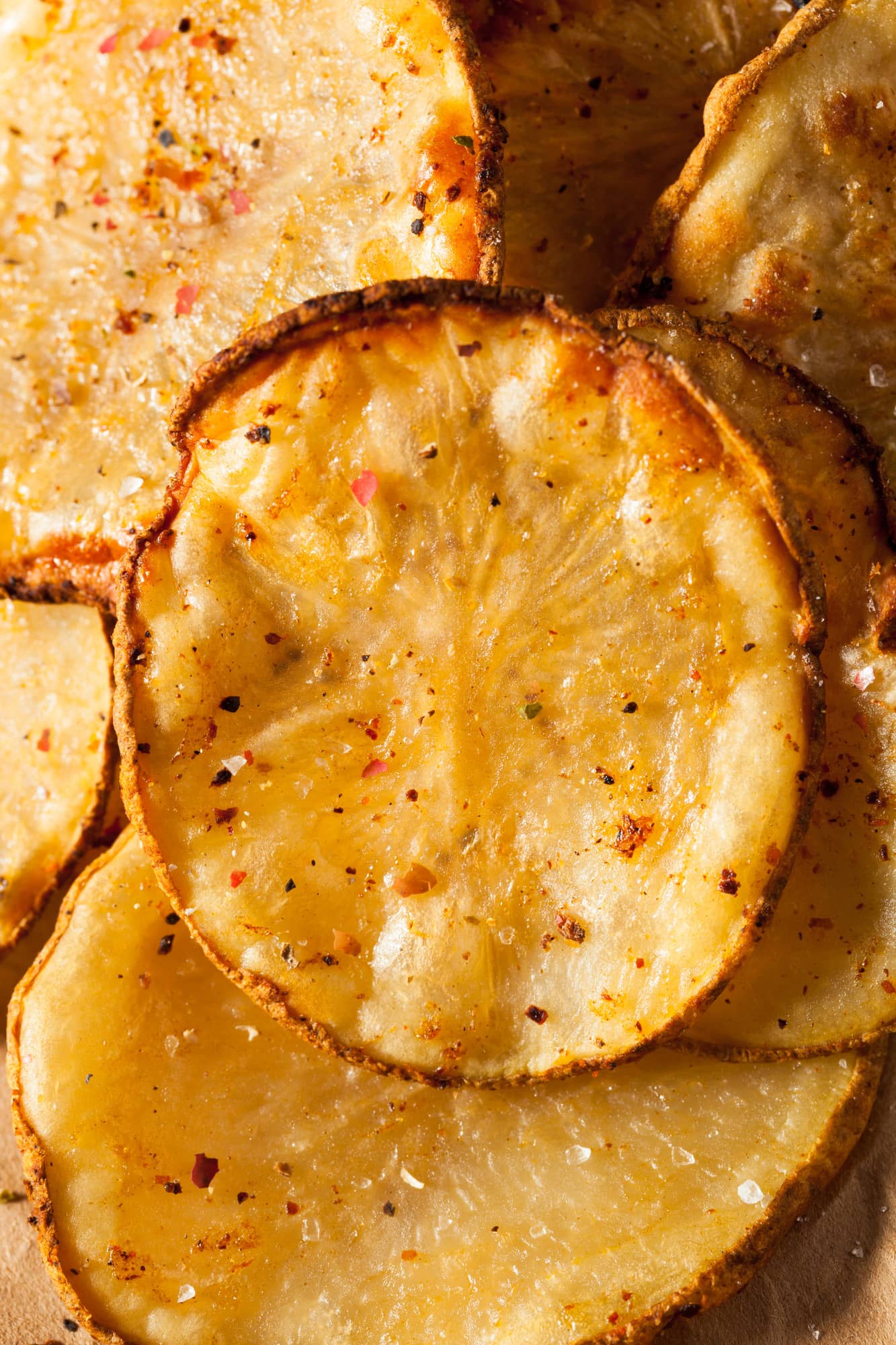Rodajas de papas con hierbas ib+®ricas.